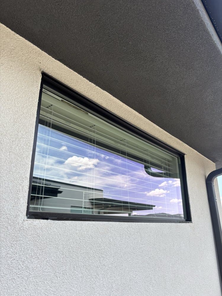 Streak-free window reflecting blue sky